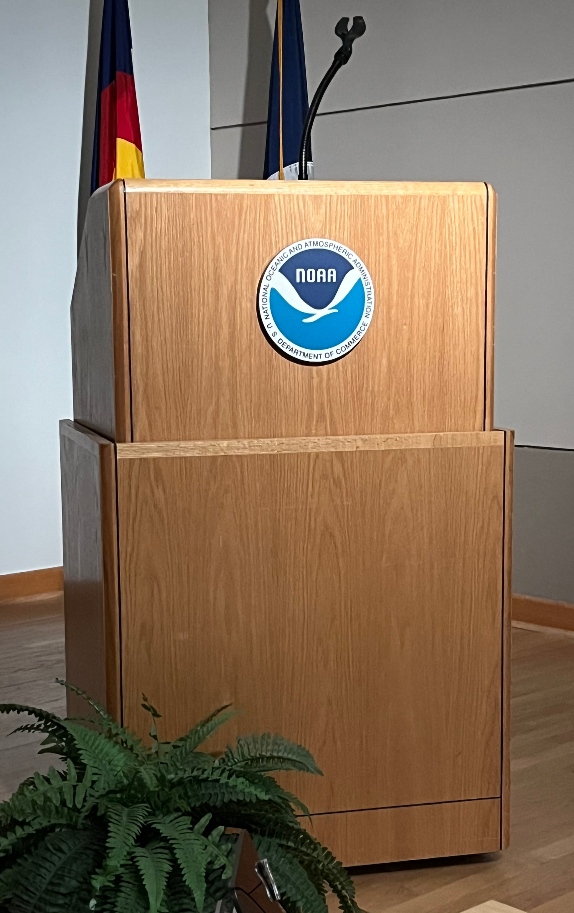 Podium with the NOAA logo on it