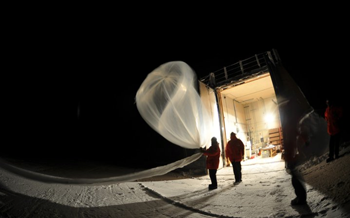 researchers with balloon